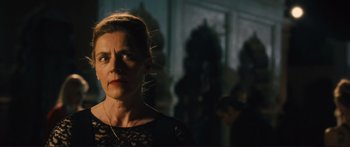 Movie still from “Our Kind of Traitor” (2016), directed by Susanna White – A person wearing a black dress; Close Up shot, Low angle