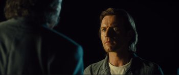 Movie still from “Our Kind of Traitor” (2016), directed by Susanna White – A person looking at a person; Close Up shot, Over the shoulder angle