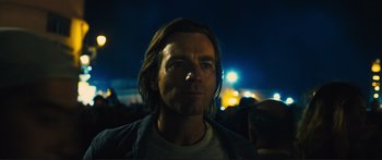 Movie still from “Our Kind of Traitor” (2016), directed by Susanna White – A person with long hair; Close Up shot, Low angle