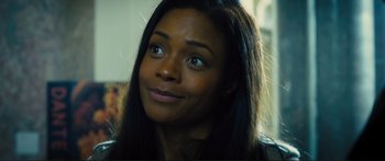 Movie still from “Our Kind of Traitor” (2016), directed by Susanna White – A person with long black hair; Close Up shot, Over the shoulder angle