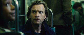 Movie still from “Our Kind of Traitor” (2016), directed by Susanna White – A person with long hair; Close Up shot, Over the shoulder angle