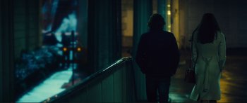 Movie still from “Our Kind of Traitor” (2016), directed by Susanna White – A person walking up a flight of stairs at night; Wide shot, Over the shoulder angle