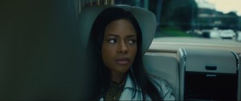 Movie still from “Our Kind of Traitor” (2016), directed by Susanna White – A woman sitting in a car with her eyes closed; Close Up shot, Over the shoulder angle
