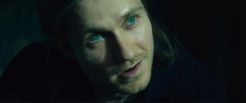 Movie still from “Our Kind of Traitor” (2016), directed by Susanna White – A person with blue eyes; Close Up shot, Over the shoulder angle