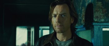 Movie still from “Our Kind of Traitor” (2016), directed by Susanna White – A person with long hair; Close Up shot, Low angle