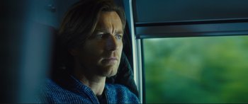 Movie still from “Our Kind of Traitor” (2016), directed by Susanna White – A person sitting in a car; Close Up shot, Low angle