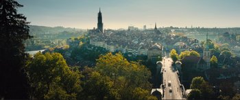 Movie still from “Our Kind of Traitor” (2016), directed by Susanna White – A view of a large city from a high point; Extreme Wide shot, High angle