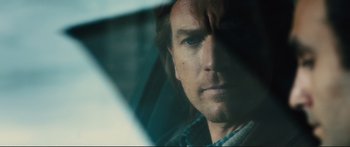 Movie still from “Our Kind of Traitor” (2016), directed by Susanna White – A man's face in a car window; Close Up shot, Over the shoulder angle