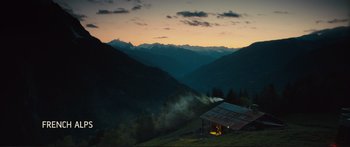 Movie still from “Our Kind of Traitor” (2016), directed by Susanna White – A cabin in the middle of the mountains at night; Extreme Wide shot, High angle