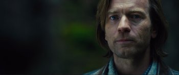 Movie still from “Our Kind of Traitor” (2016), directed by Susanna White – A person with long hair; Close Up shot, Over the shoulder angle