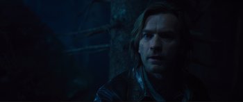 Movie still from “Our Kind of Traitor” (2016), directed by Susanna White – A person wearing a leather jacket; Close Up shot, Over the shoulder angle
