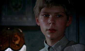 Movie still from “Our Mother's House” (1967), directed by Jack Clayton – A young boy is looking into the camera; Close Up shot, Over the shoulder angle