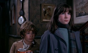 Movie still from “Our Mother's House” (1967), directed by Jack Clayton – A young boy and a young girl standing next to each other; Medium shot, Low angle