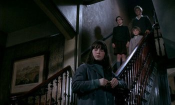 Movie still from “Our Mother's House” (1967), directed by Jack Clayton – A group of people standing on top of a set of stairs; Wide shot, Low angle