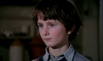 Movie still from “Our Mother's House” (1967), directed by Jack Clayton – A young boy is looking into the distance; Close Up shot, High angle