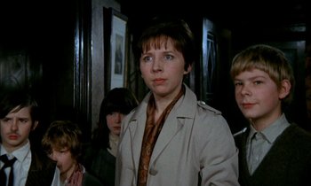 Movie still from “Our Mother's House” (1967), directed by Jack Clayton – A group of young people standing next to each other in a room; Close Up shot, Low angle