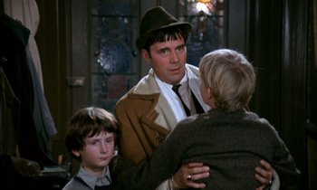 Movie still from “Our Mother's House” (1967), directed by Jack Clayton – A group of people standing next to each other in a room; Medium shot, Over the shoulder angle