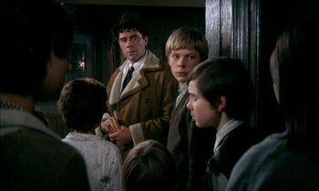 Movie still from “Our Mother's House” (1967), directed by Jack Clayton – A group of people standing next to each other in a room; Medium shot, Over the shoulder angle