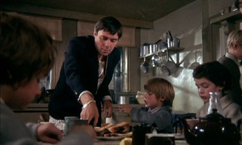 Movie still from “Our Mother's House” (1967), directed by Jack Clayton – A man and a boy are in a kitchen preparing a meal; Medium shot, Low angle
