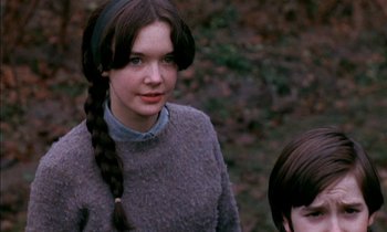 Movie still from “Our Mother's House” (1967), directed by Jack Clayton – A young woman with a long braid standing next to a young boy; Close Up shot, Over the shoulder angle