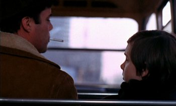 Movie still from “Our Mother's House” (1967), directed by Jack Clayton – A man and a boy sitting on a bus together; Close Up shot, Over the shoulder angle