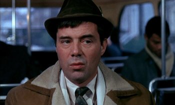 Movie still from “Our Mother's House” (1967), directed by Jack Clayton – A person wearing a hat and a coat; Close Up shot, Over the shoulder angle