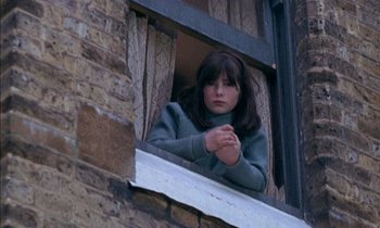 Movie still from “Our Mother's House” (1967), directed by Jack Clayton – A young woman looking out of a window; Close Up shot, High angle