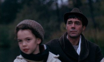 Movie still from “Our Mother's House” (1967), directed by Jack Clayton – A man and a boy are standing next to each other; Close Up shot, Over the shoulder angle