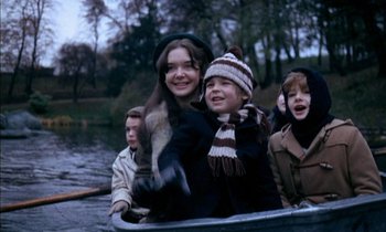 Movie still from “Our Mother's House” (1967), directed by Jack Clayton – A group of children in a boat on a river; Medium shot, High angle