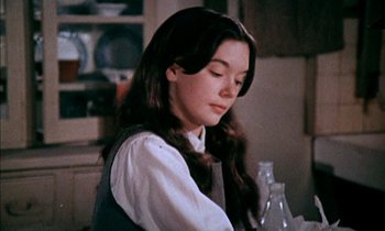 Movie still from “Our Mother's House” (1967), directed by Jack Clayton – A young woman sitting at a table in front of a plate; Close Up shot, High angle