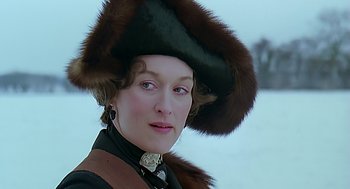 Movie still from “Out of Africa” (1985), directed by Sydney Pollack – A person wearing a hat; Close Up shot, Over the shoulder angle