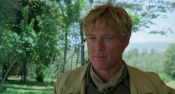 Movie still from “Out of Africa” (1985), directed by Sydney Pollack – A person wearing a jacket; Close Up shot, Over the shoulder angle