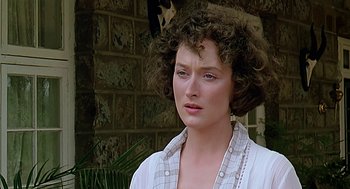 Movie still from “Out of Africa” (1985), directed by Sydney Pollack – A person wearing a white shirt; Close Up shot, Over the shoulder angle