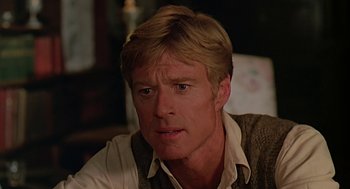Movie still from “Out of Africa” (1985), directed by Sydney Pollack – A person wearing a sweater; Close Up shot, Over the shoulder angle