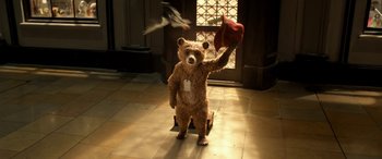 Movie still from “Paddington” (2014), directed by Paul King – A teddy bear is standing in the middle of the floor; Medium shot, Low angle