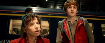 Movie still from “Paddington” (2014), directed by Paul King – A woman and a young boy standing next to each other; Close Up shot, Over the shoulder angle