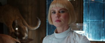 Movie still from “Paddington” (2014), directed by Paul King – A woman with blonde hair wearing an apron; Close Up shot, Over the shoulder angle