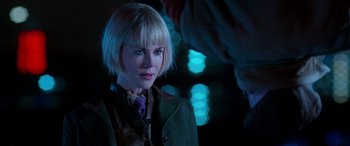 Movie still from “Paddington” (2014), directed by Paul King – A woman with blonde hair wearing a green jacket; Close Up shot, Over the shoulder angle