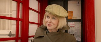 Movie still from “Paddington” (2014), directed by Paul King – A woman with blonde hair wearing a green hat; Close Up shot, Low angle