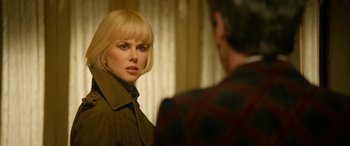 Movie still from “Paddington” (2014), directed by Paul King – A woman standing next to a man in a room; Close Up shot, Over the shoulder angle