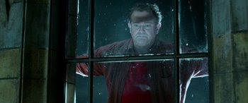 Movie still from “Paddington” (2014), directed by Paul King – A man standing in front of an open window; Close Up shot, Low angle