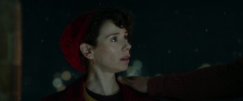 Movie still from “Paddington” (2014), directed by Paul King – A woman is getting her hair combed by a person; Close Up shot, Over the shoulder angle