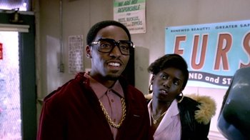 Movie still from “Paid in Full” (2002), directed by Charles Stone III – A man and a woman standing next to each other; Close Up shot, Over the shoulder angle