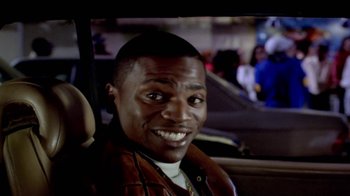 Movie still from “Paid in Full” (2002), directed by Charles Stone III – A person sitting in a car; Close Up shot, High angle