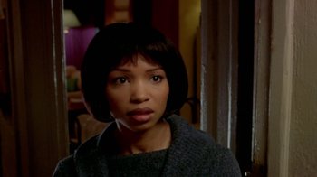 Movie still from “Paid in Full” (2002), directed by Charles Stone III – A person with short black hair; Close Up shot, Over the shoulder angle