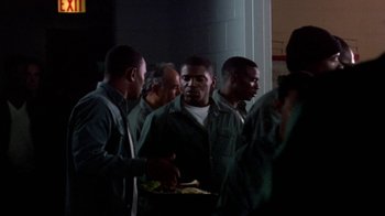 Movie still from “Paid in Full” (2002), directed by Charles Stone III – A group of men standing next to each other holding food; Medium shot, High angle