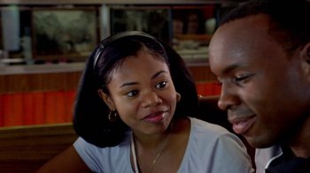 Movie still from “Paid in Full” (2002), directed by Charles Stone III – A man and a woman sitting next to each other; Close Up shot, Over the shoulder angle