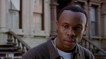 Movie still from “Paid in Full” (2002), directed by Charles Stone III – A person wearing a jacket; Close Up shot, Low angle