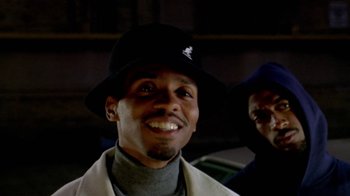 Movie still from “Paid in Full” (2002), directed by Charles Stone III – A person wearing a hat; Close Up shot, Low angle