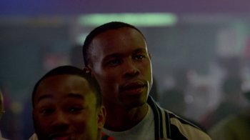 Movie still from “Paid in Full” (2002), directed by Charles Stone III – Two men are standing in front of each other; Close Up shot, Low angle